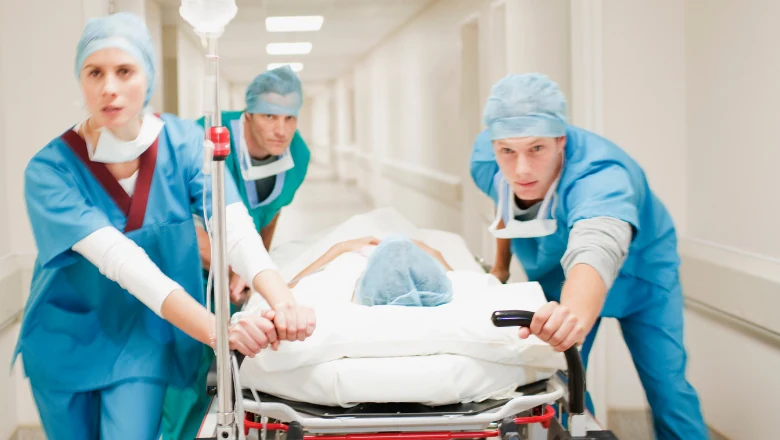Illustrative photograph of a medical team transporting a patient